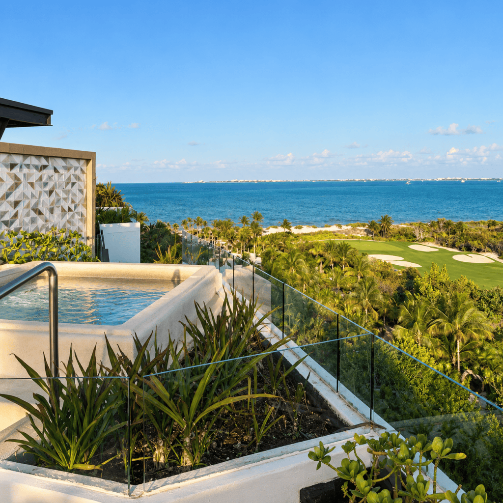 View of the beach and turquoise Caribbean Sea from an INSPIRA Rooftop Suite at ATELIER Playa Mujeres, Mexico.